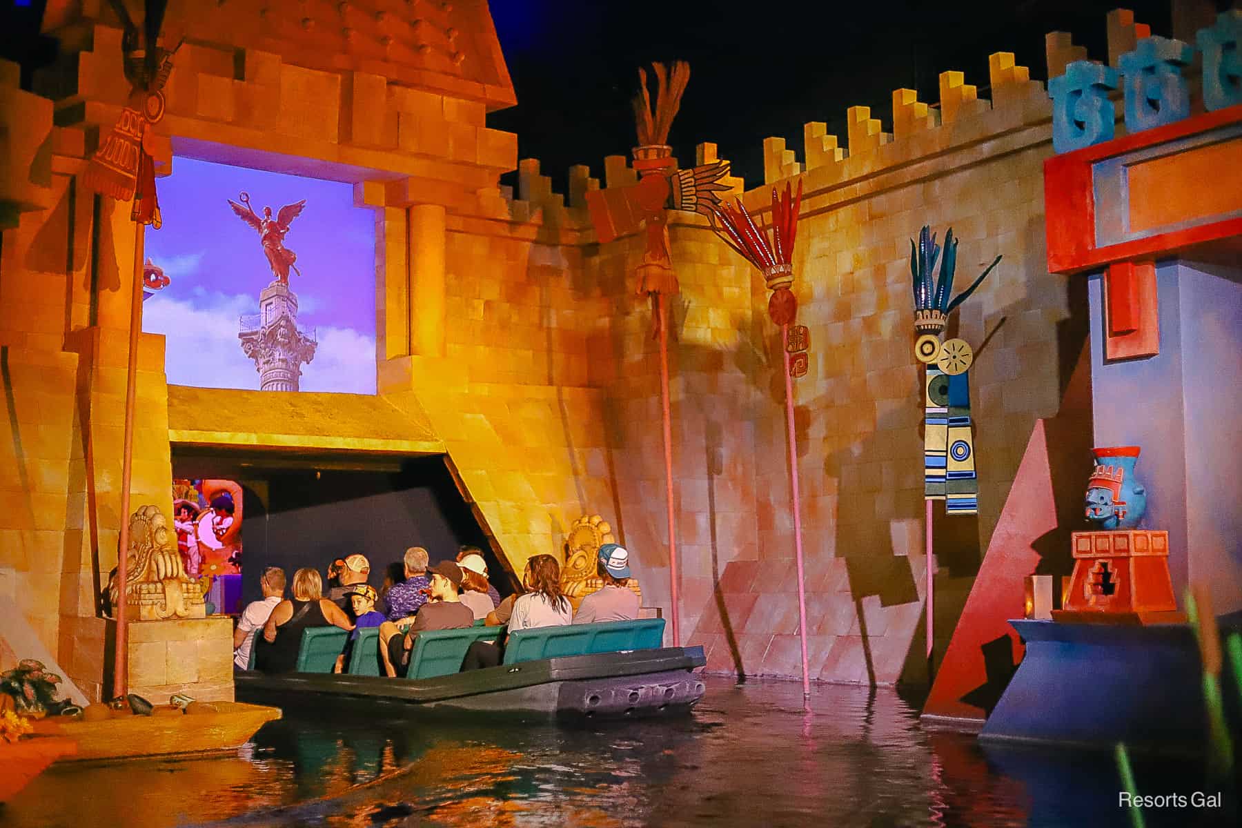 guests riding the boat ride in the Mexico Pavilion 