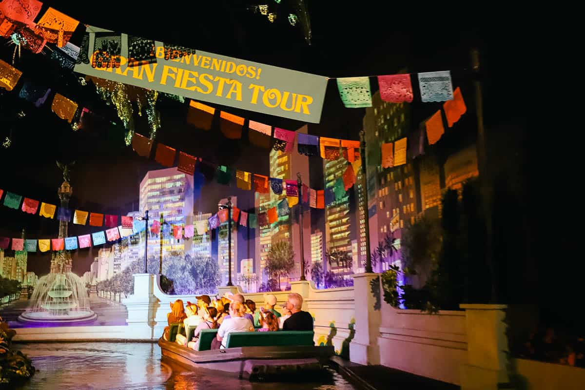 A sign overhead welcoming guests to the Gran Fiesta Tour. 