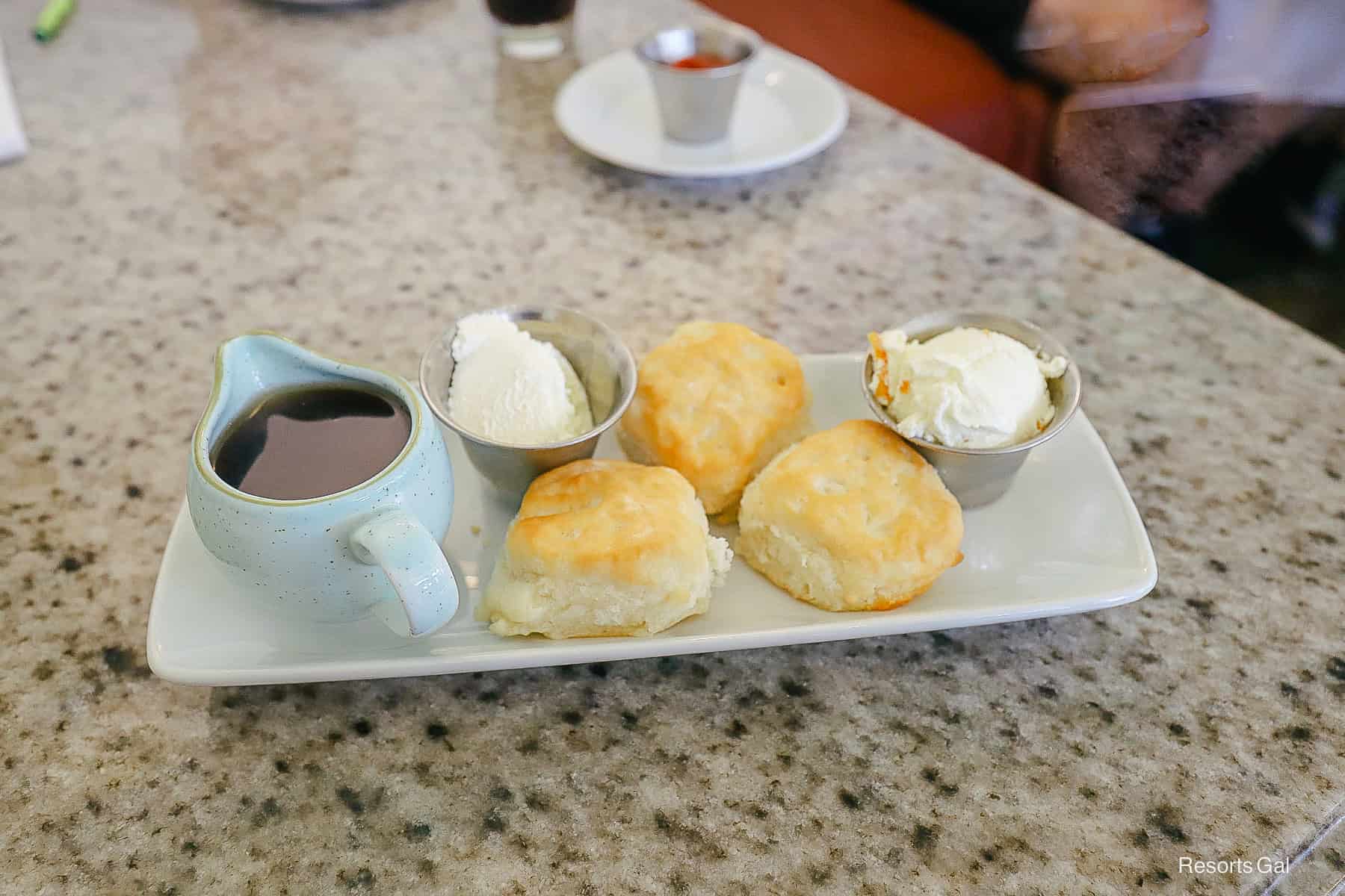 a platter of biscuits with regular butter and orange butter at the Grand Floridian Cafe