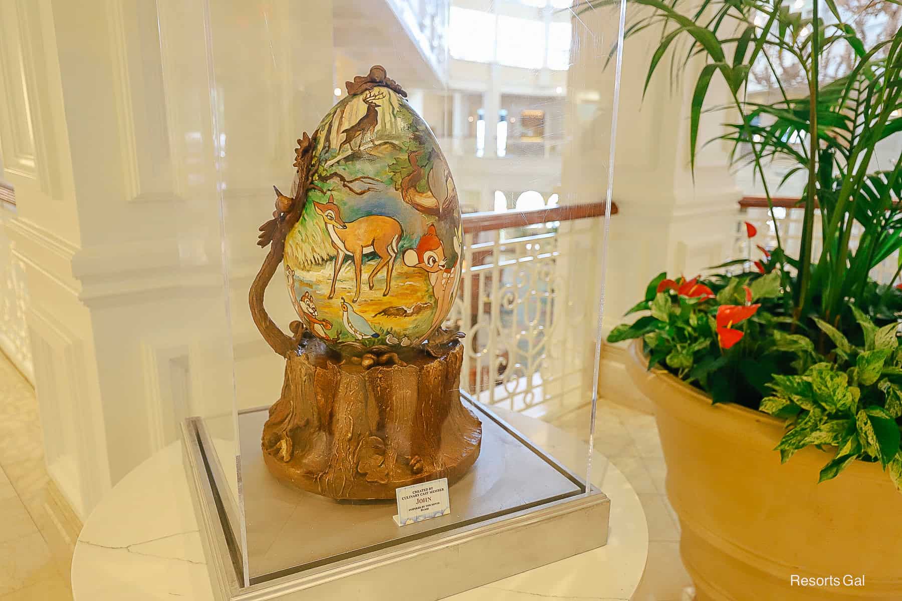 an easter egg in a glass case