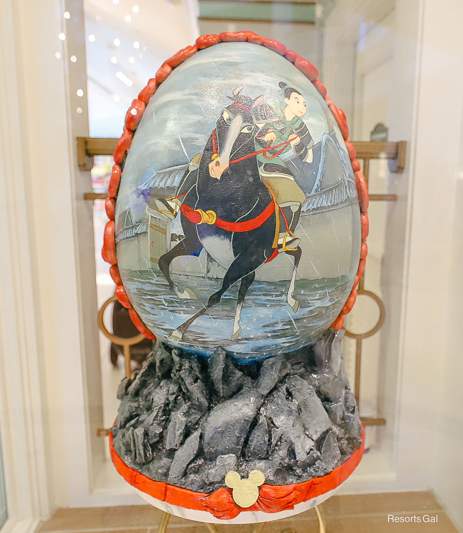 the front side of the Easter Egg features Mulan riding a horse