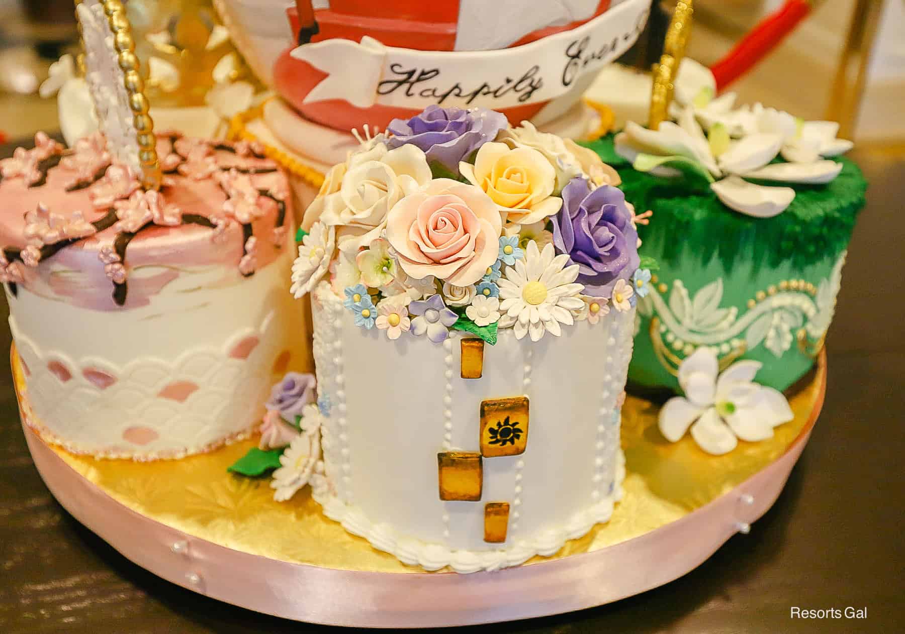 a Rapunzel themed cake at the base of the egg