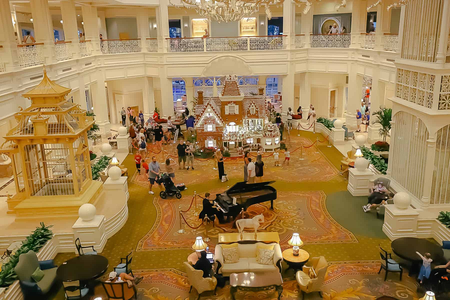 guests enjoying the lobby of the Grand Floridian during Christmas