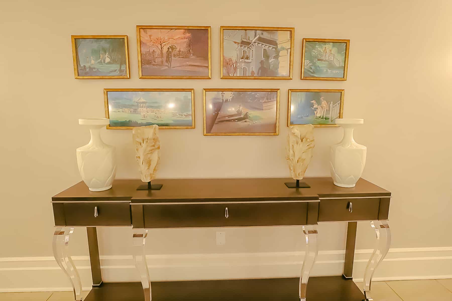 paintings hung over a sofa table in the lobby of Conch Key 