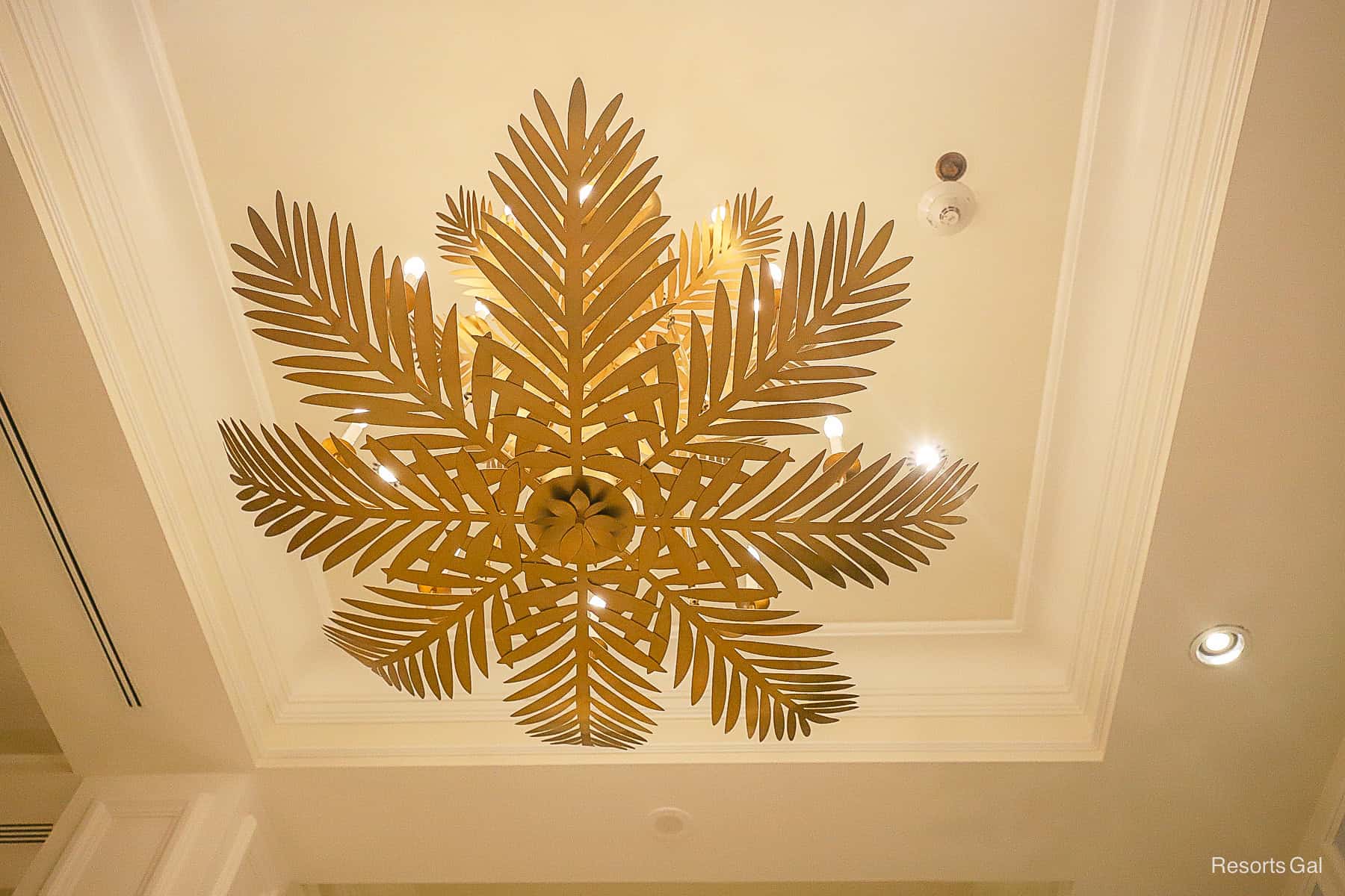 a decorative golden fan light fixture
