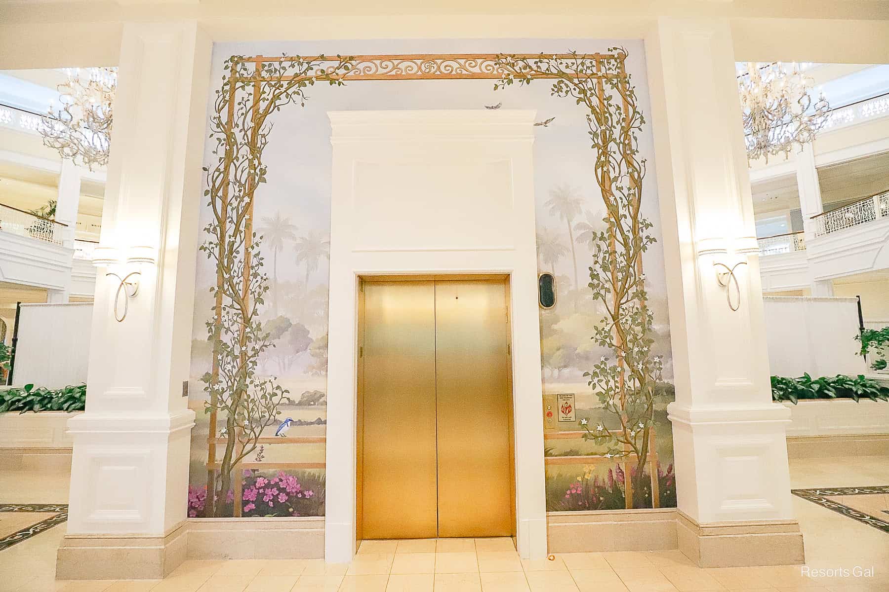 a mural that surrounds the elevator of the Grand Floridian