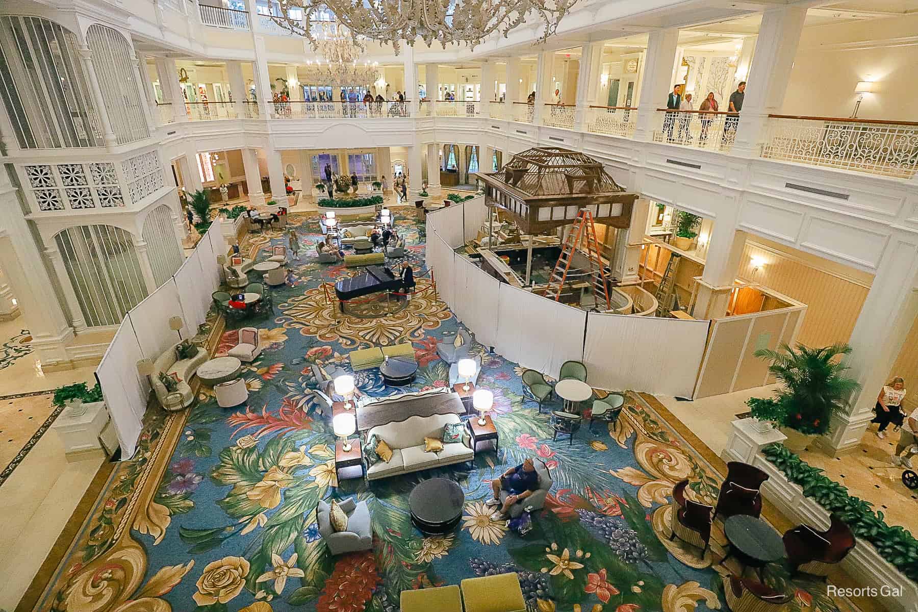 a wall surrounds the bird cage bar being built in the lobby of the Grand Floridian