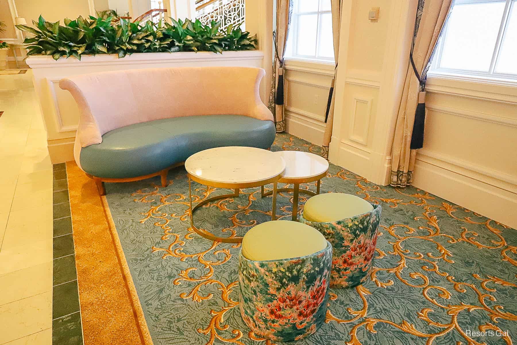 a settee with small tables and stool style seats