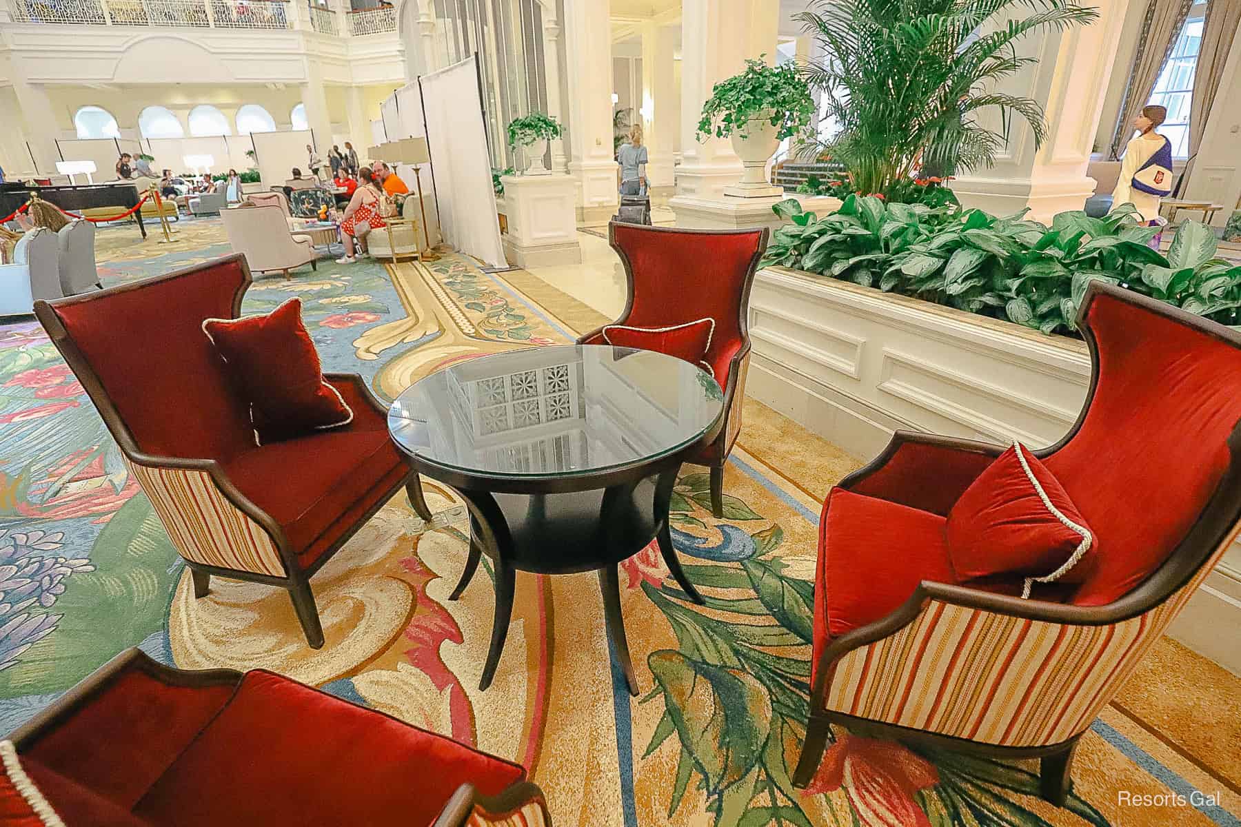 a new set of furniture that's covered in red velvet in Grand Floridian's lobby