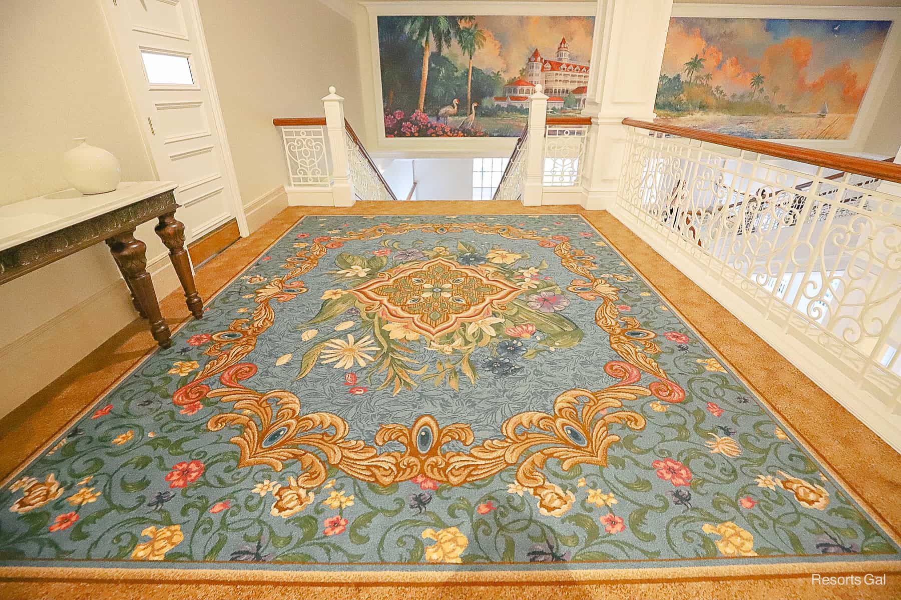 a decorative area of custom carpet in blues and golds