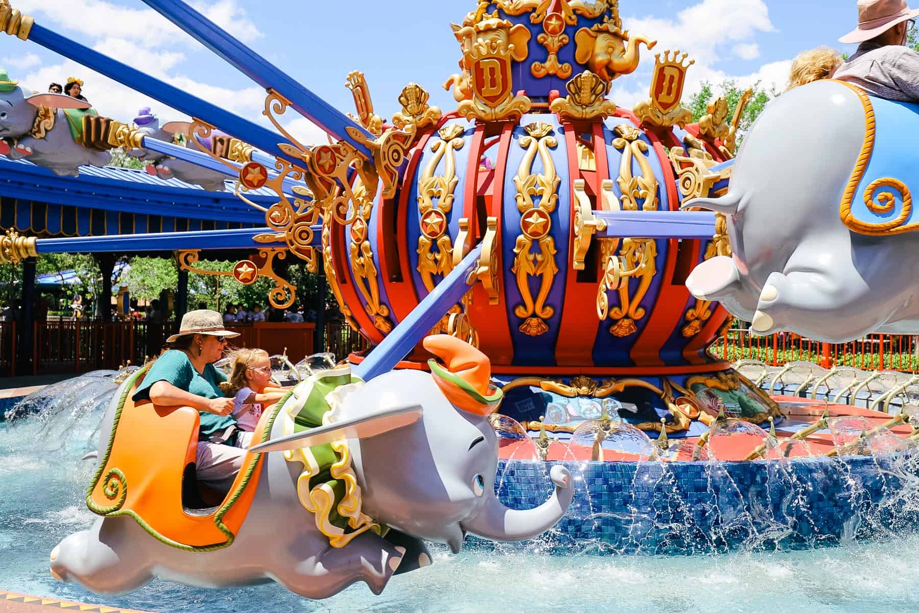 Guests riding Dumbo, the Flying Elephant. 