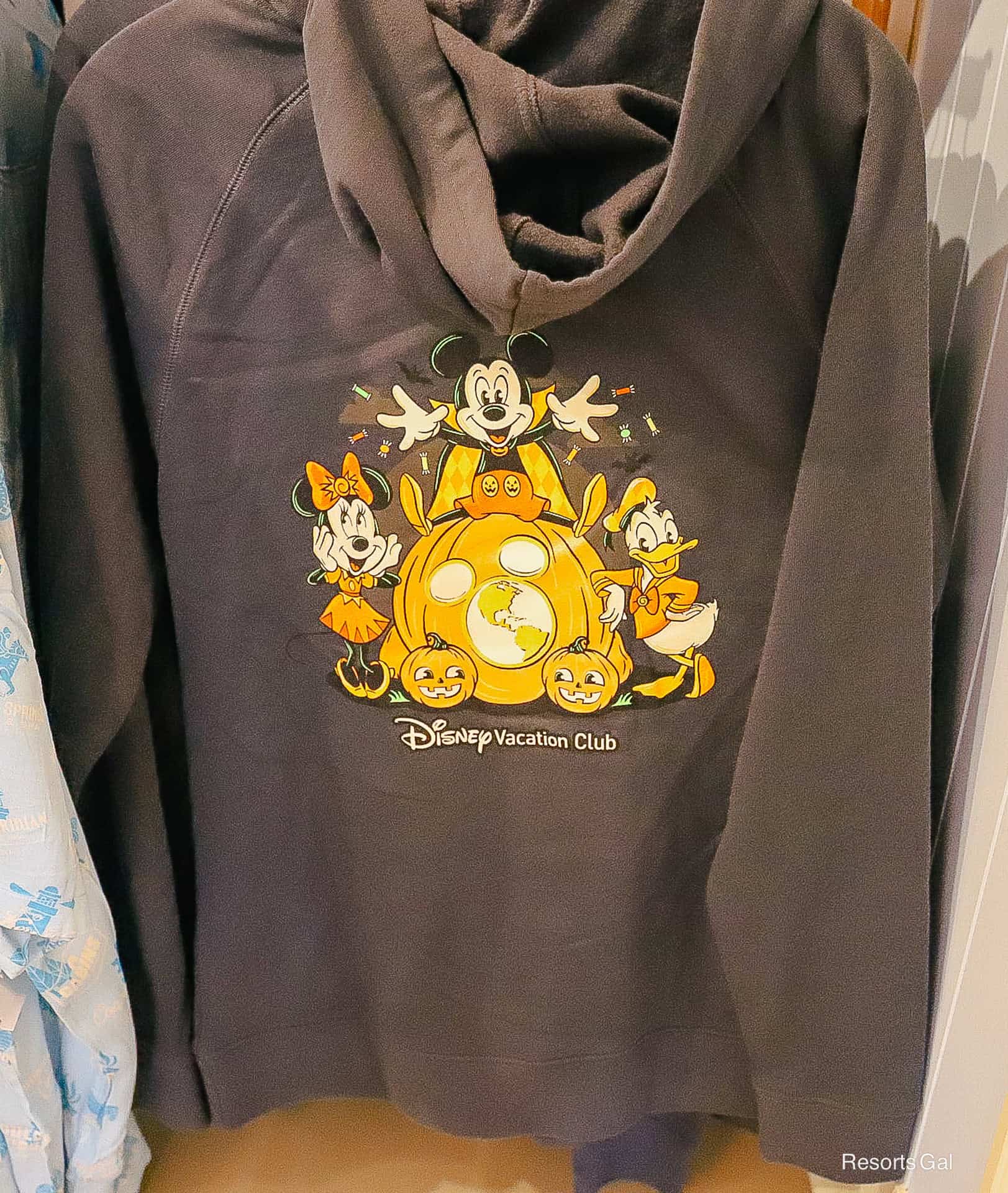 back of the 2026 Disney Vacation Club Halloween sweatshirt with design and hood