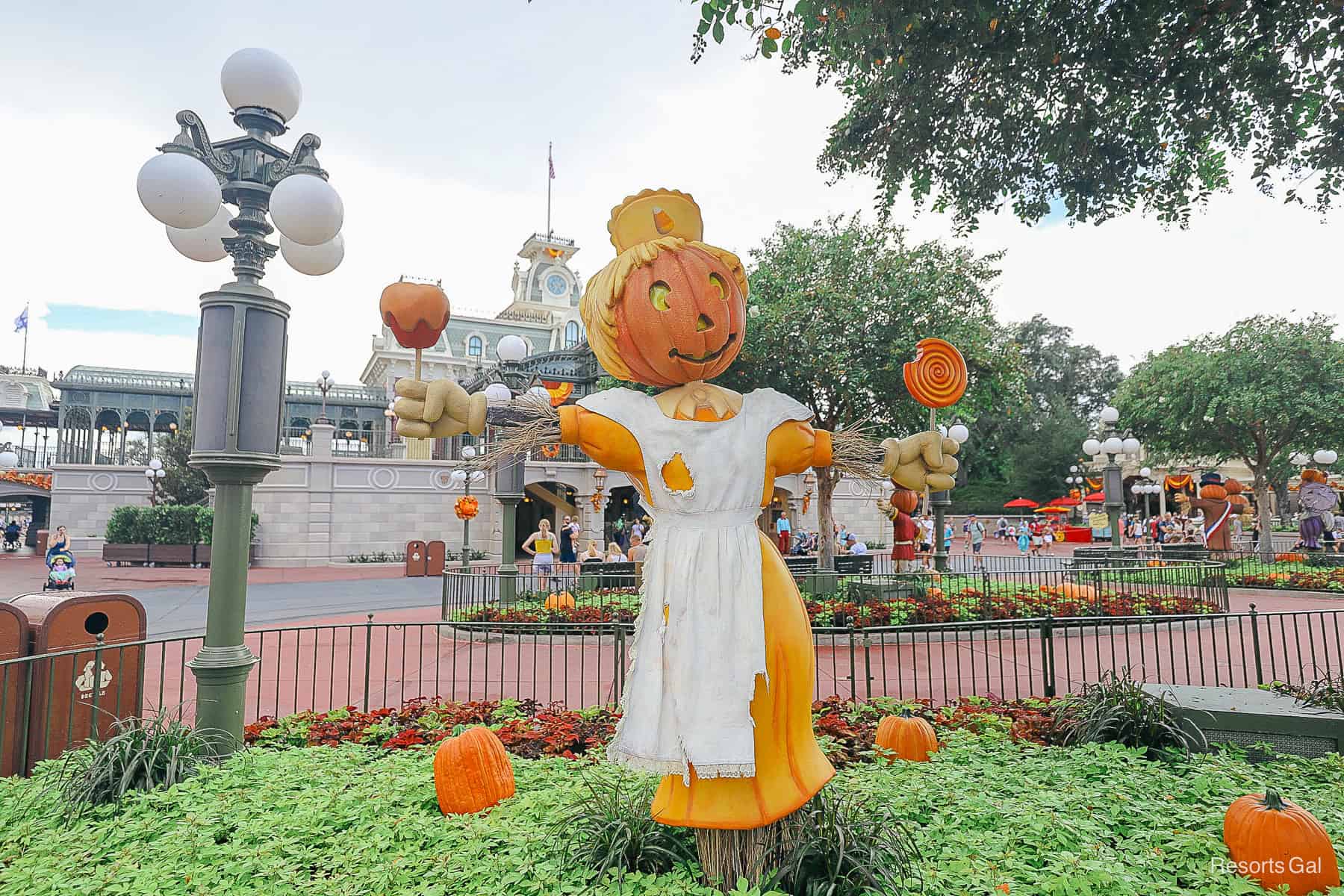 a candy scare crow is enticing guests with Halloween treats on Main Street USA 