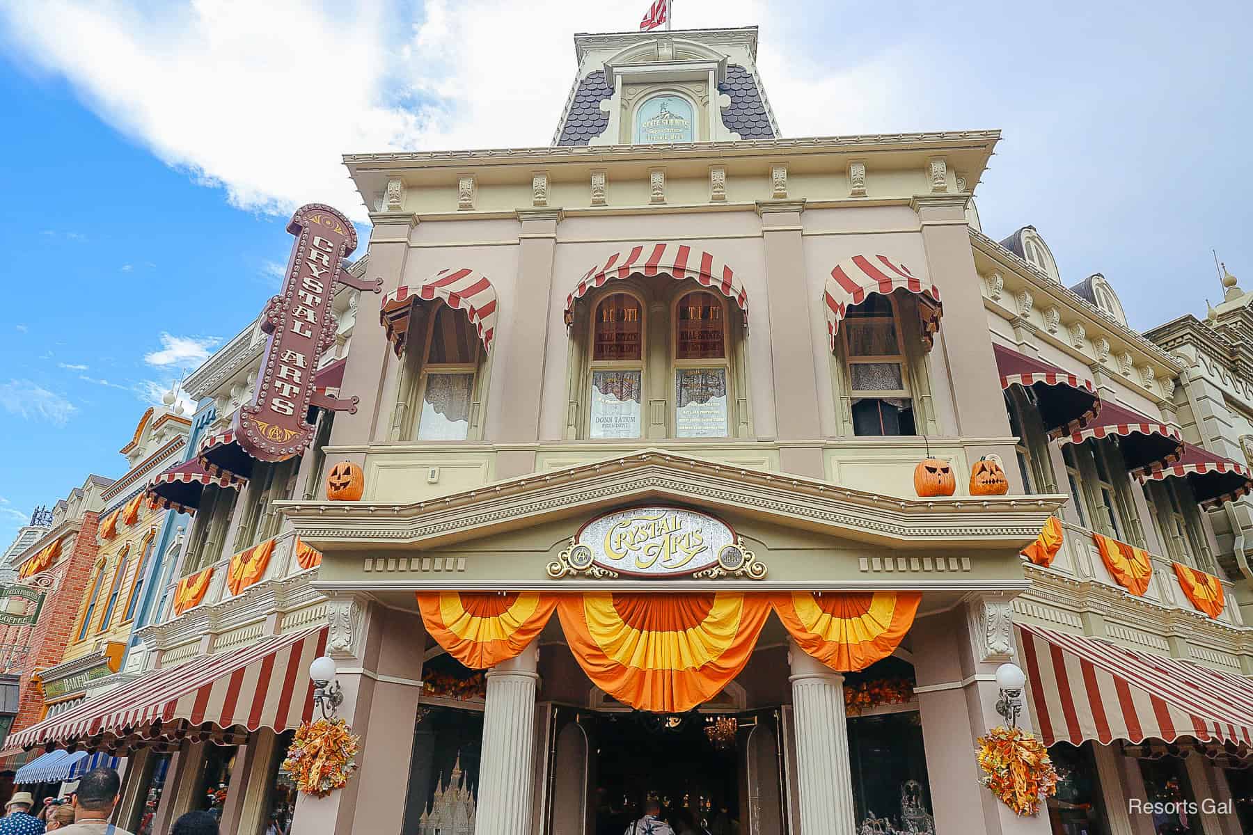 Crystal Arts shop on Main Street with pumpkins resting above the sign 