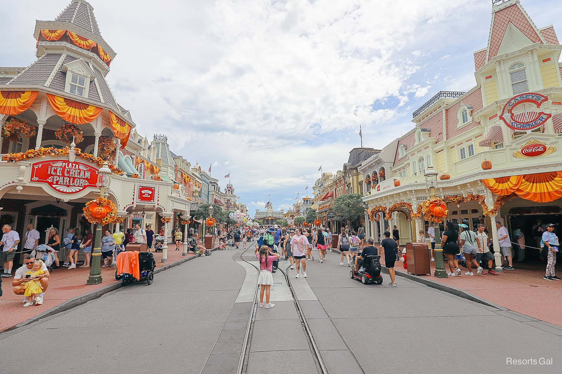 Main Street U.S.A. decorated for Halloween at Magic Kingdom in 2025 with Mickey pumpkins and fall garlands
