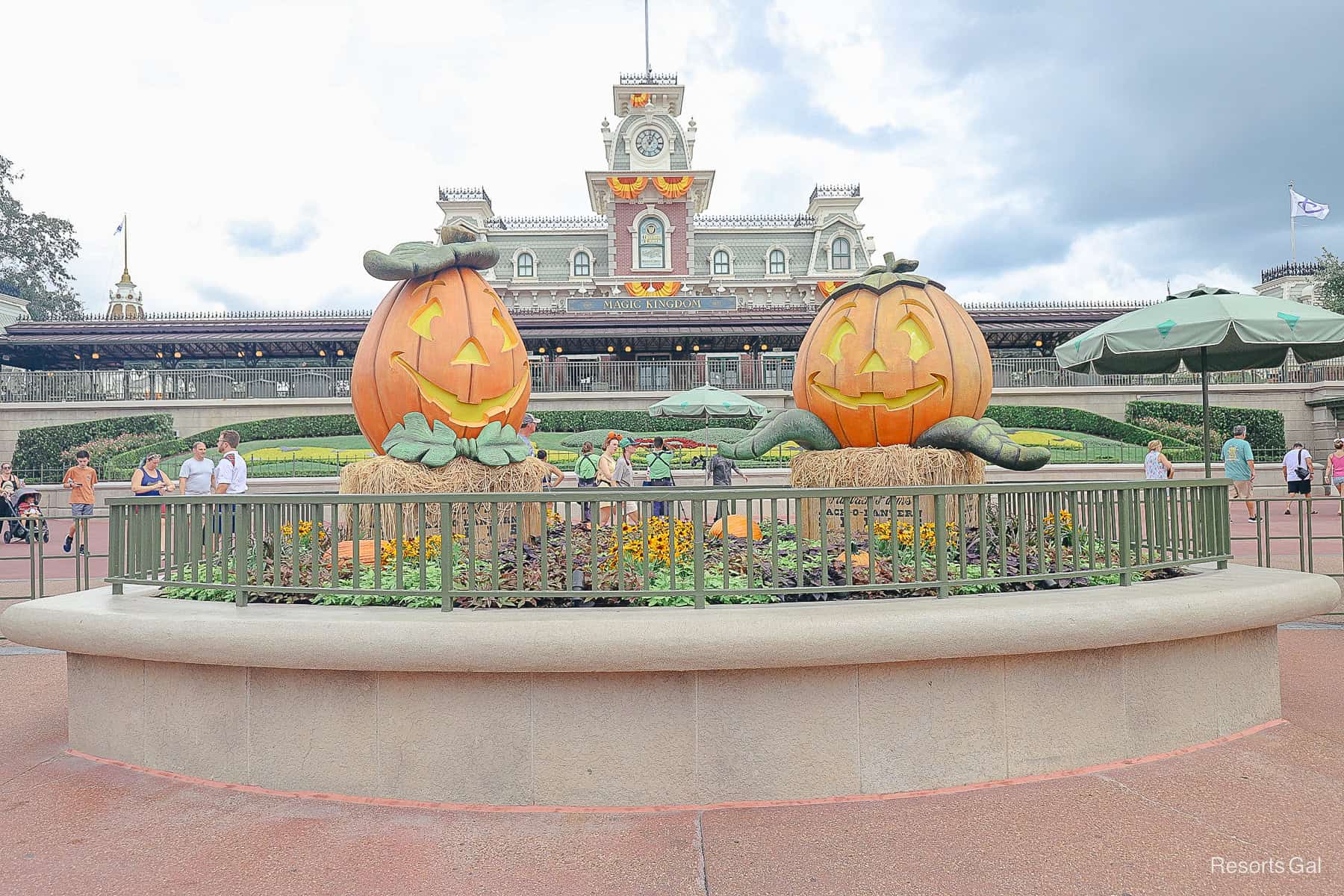 two pumpkins for guests to take photos outside Magic Kingdom's entrance 