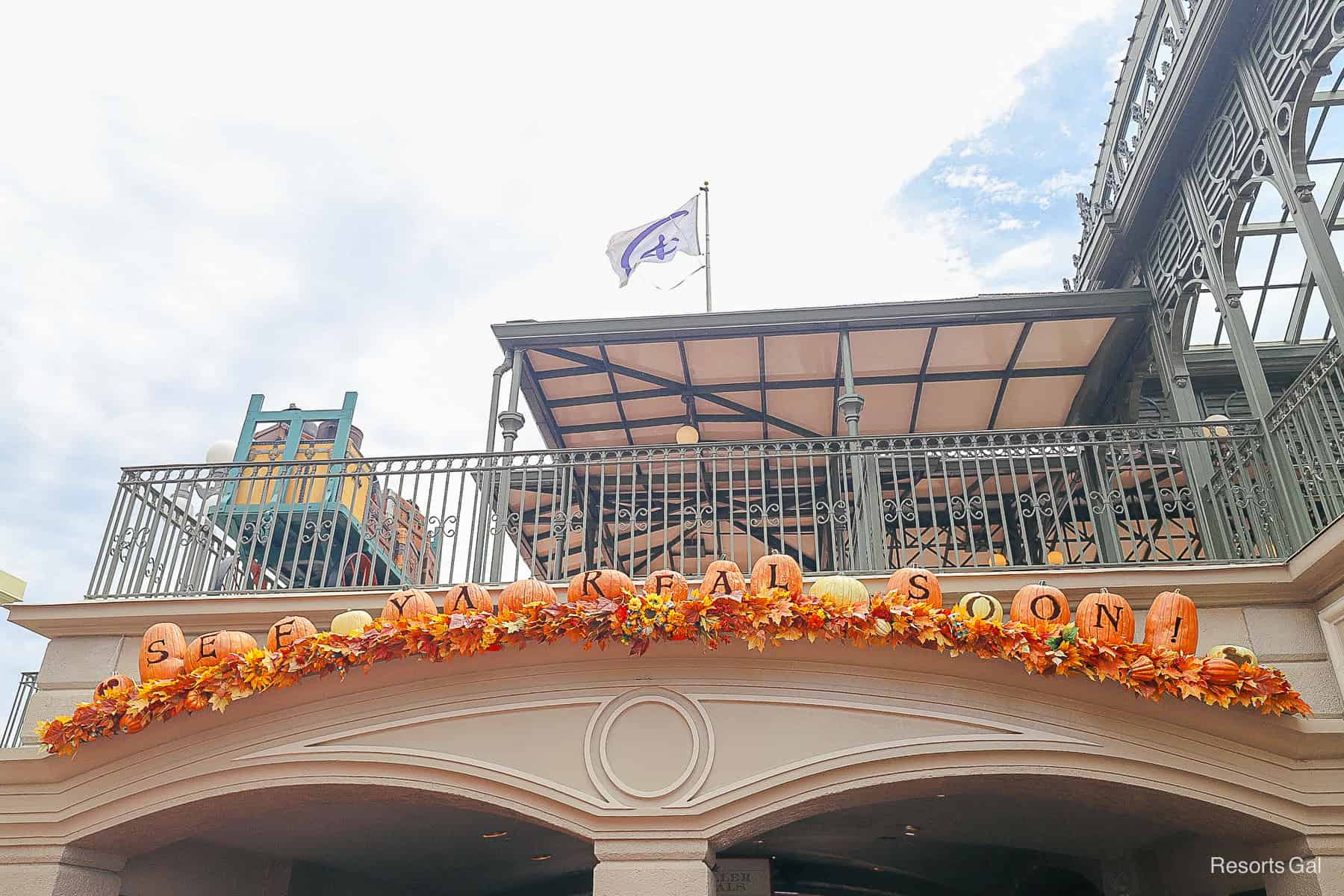 a sign that says See Ya Real Soon spelled out in pumpkins when you exit Magic Kingdom 