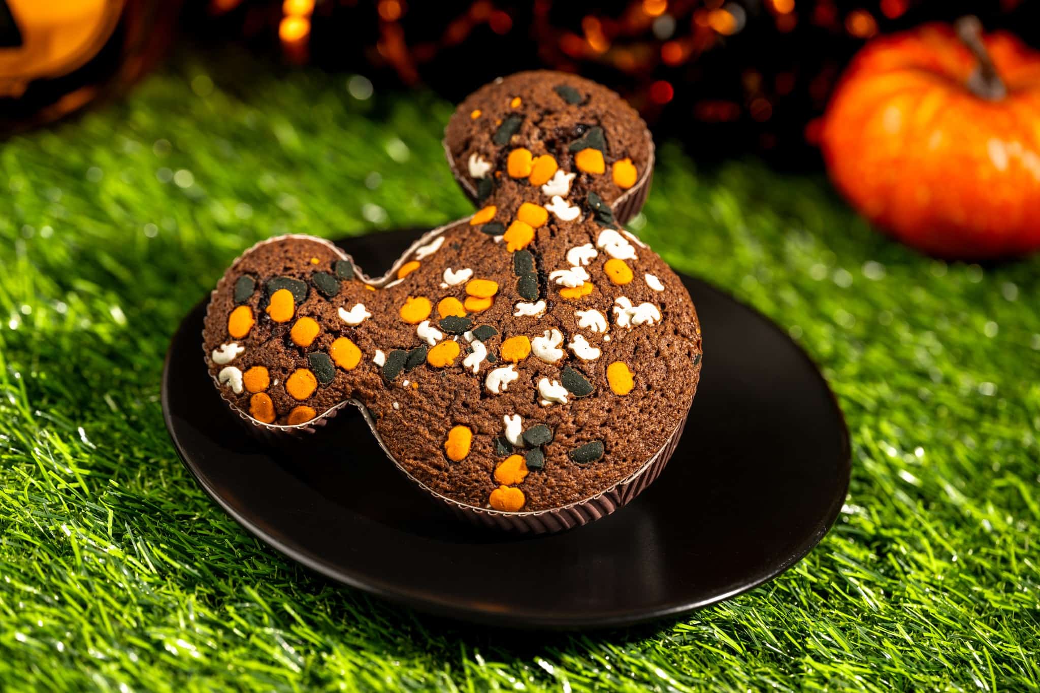 a mickey shaped brownie covered in Halloween confetti sprinkles 
