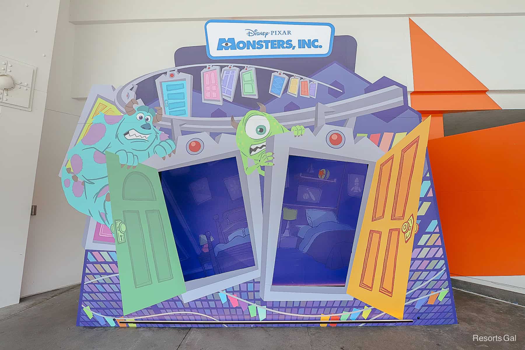 Step in the box to take a photo behind the doors with Sulley and Mike 
