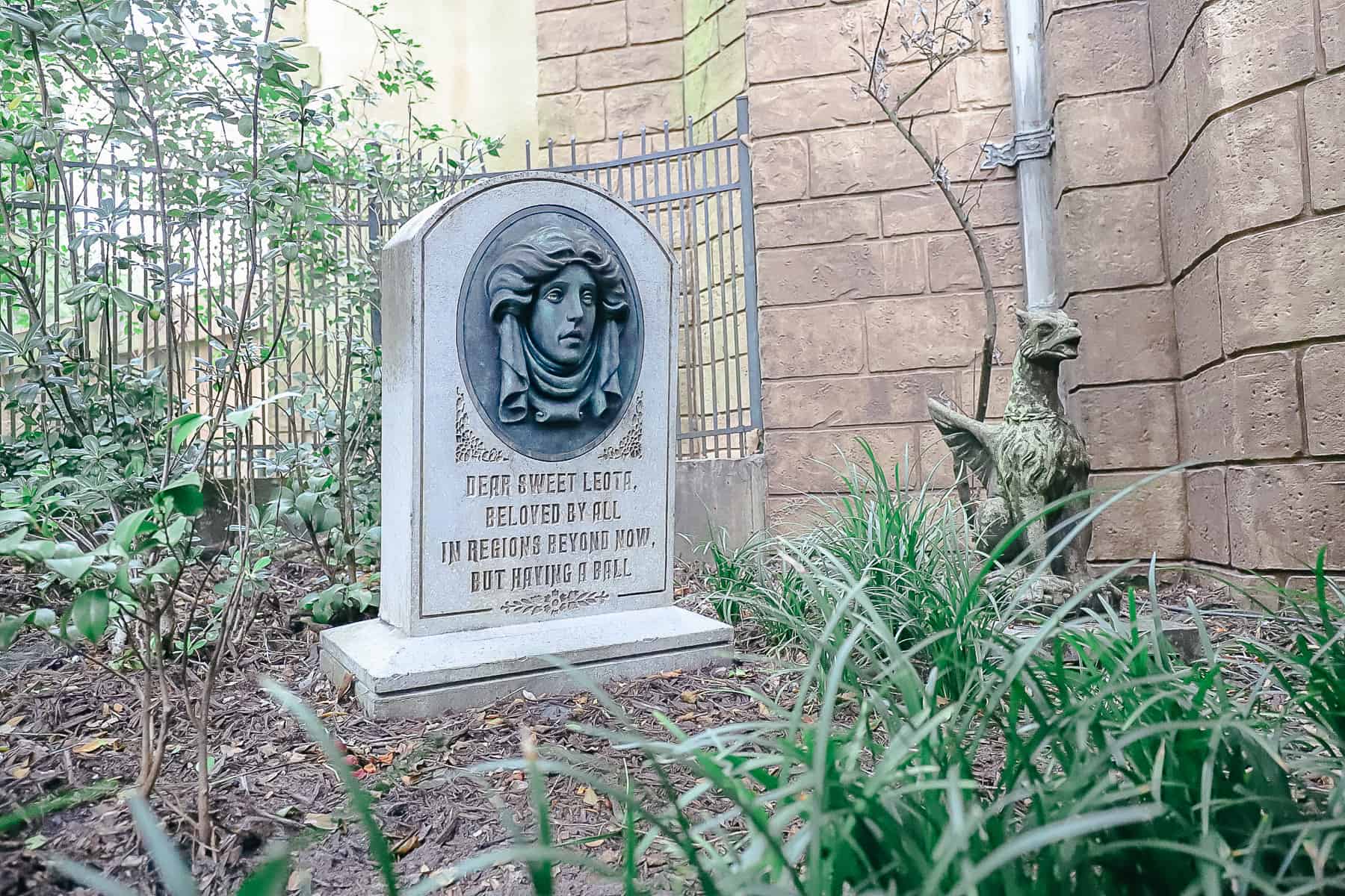 Madame Leota's tombstone in the graveyard outside the Haunted Mansion. 
