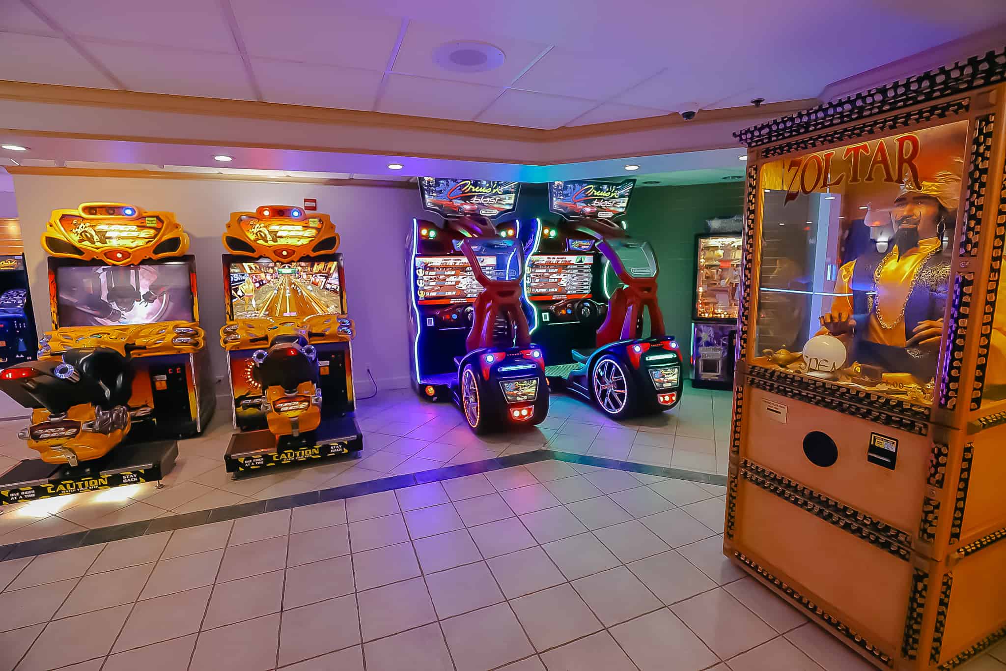 arcade with various games and an old-fashioned Zoltar machine 