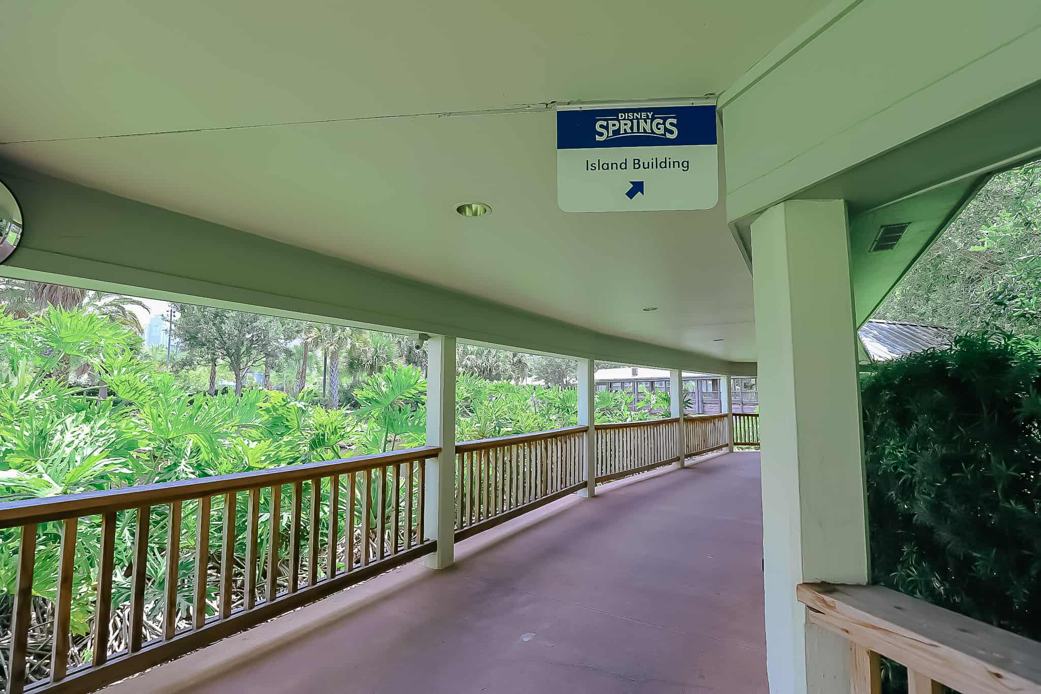 sign that says this way to Disney Springs and the Island Building 