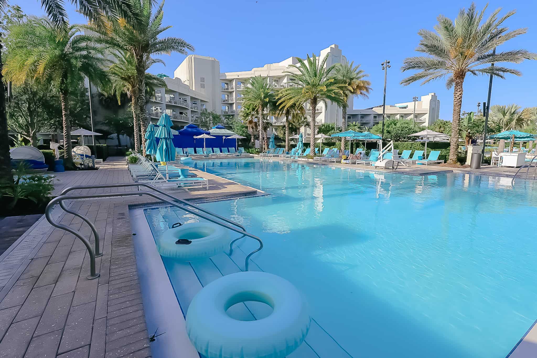 two inner tubes at the edge of the pool