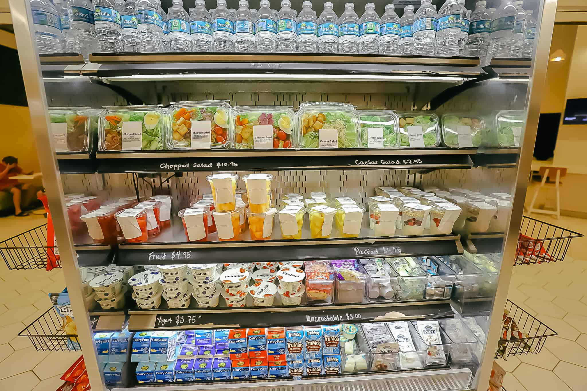 a case with grab and go salads, fruit, yogurt, and children's items like Uncrustables 