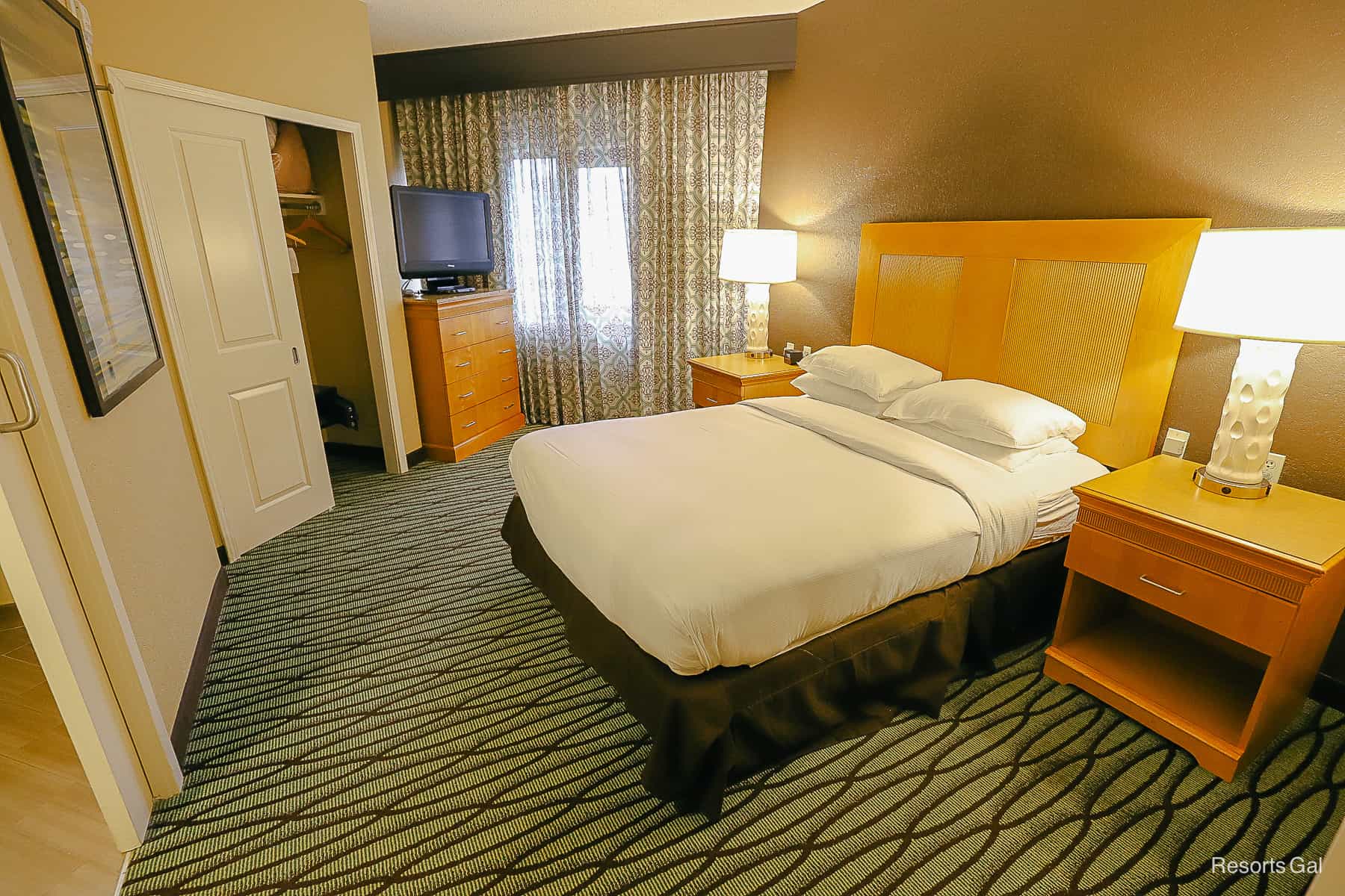 King size bed with layout of room Hilton Doubletree Suites Orlando 