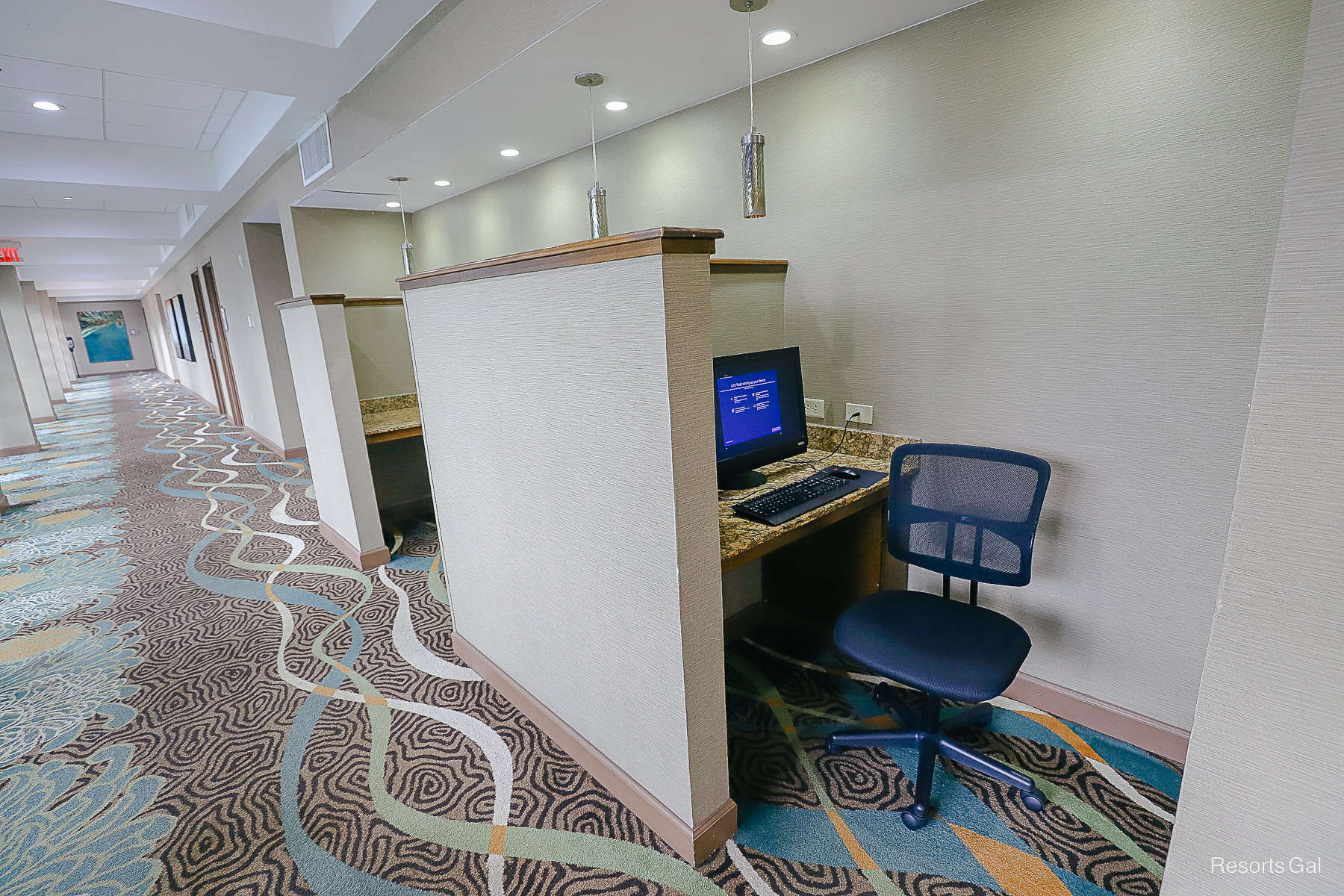 cubicles providing work stations for guests with computer access