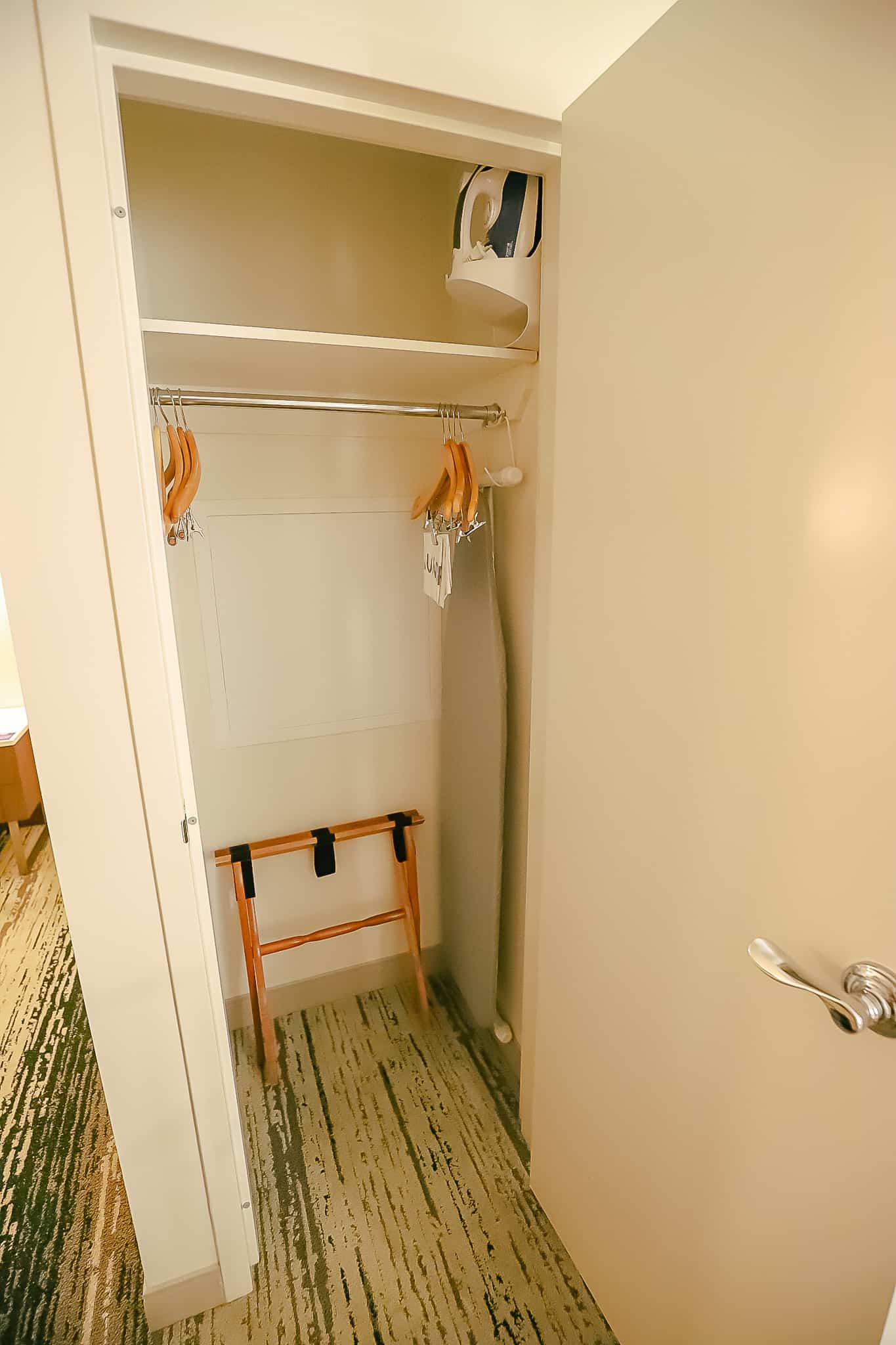 closet with iron and ironing board in the Signia Hilton Room 