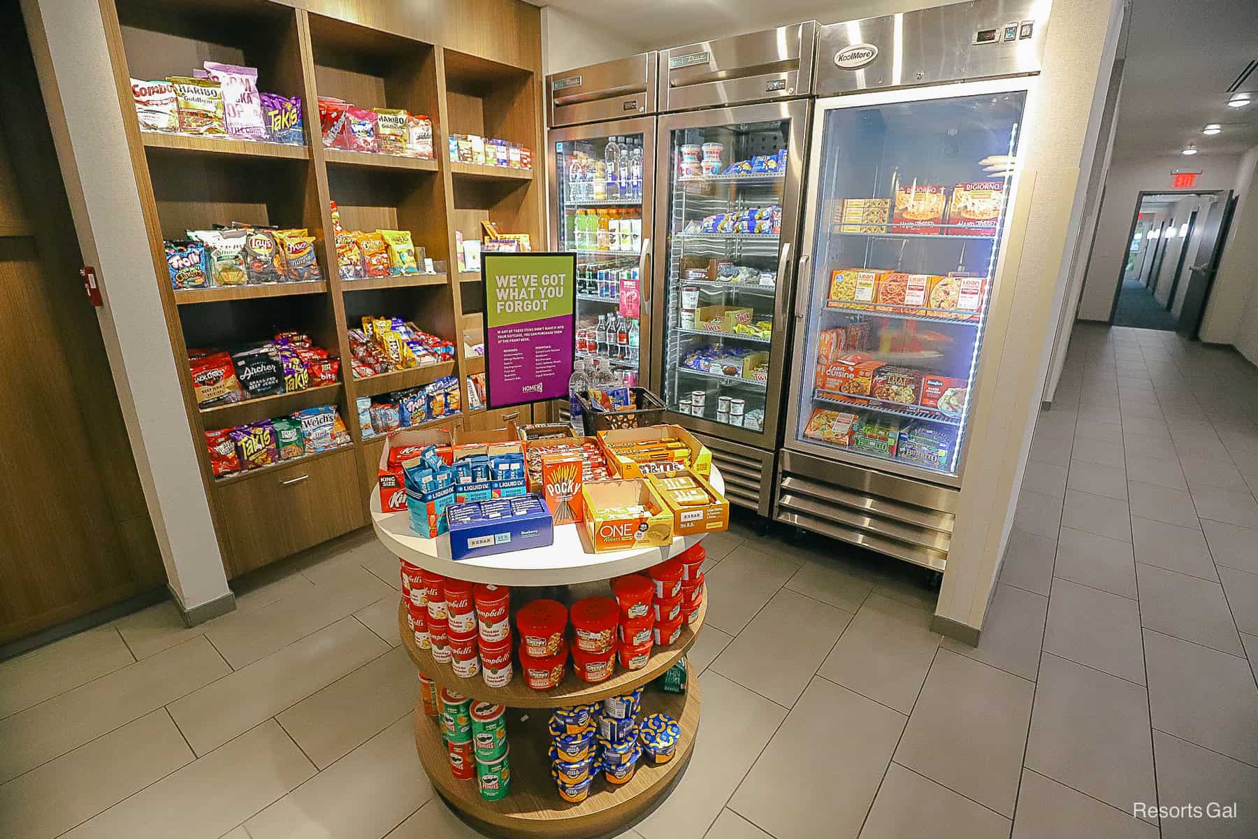 a market pantry with snack items and frozen food meals that guests can purchase 
