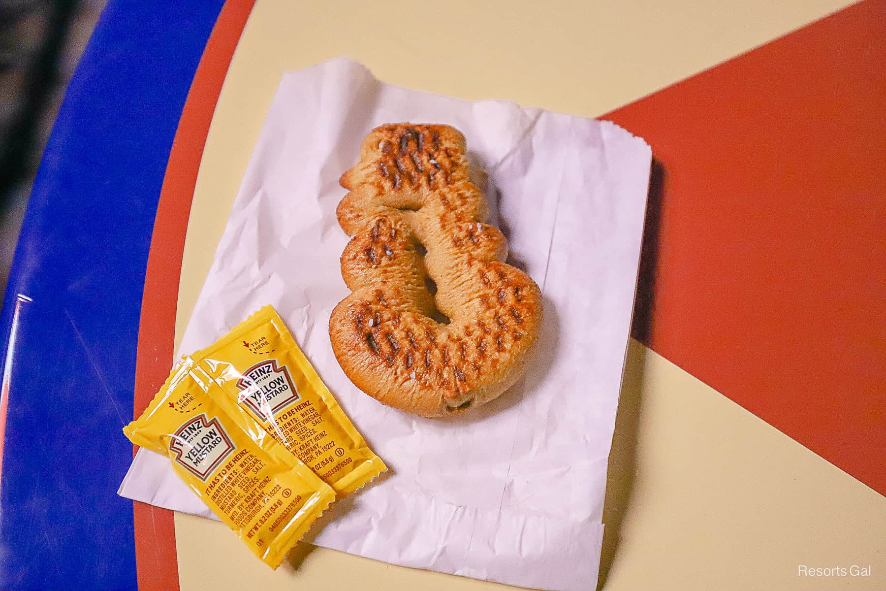 a snowman-shaped pretzel from the Storybook Circus treat location during the party