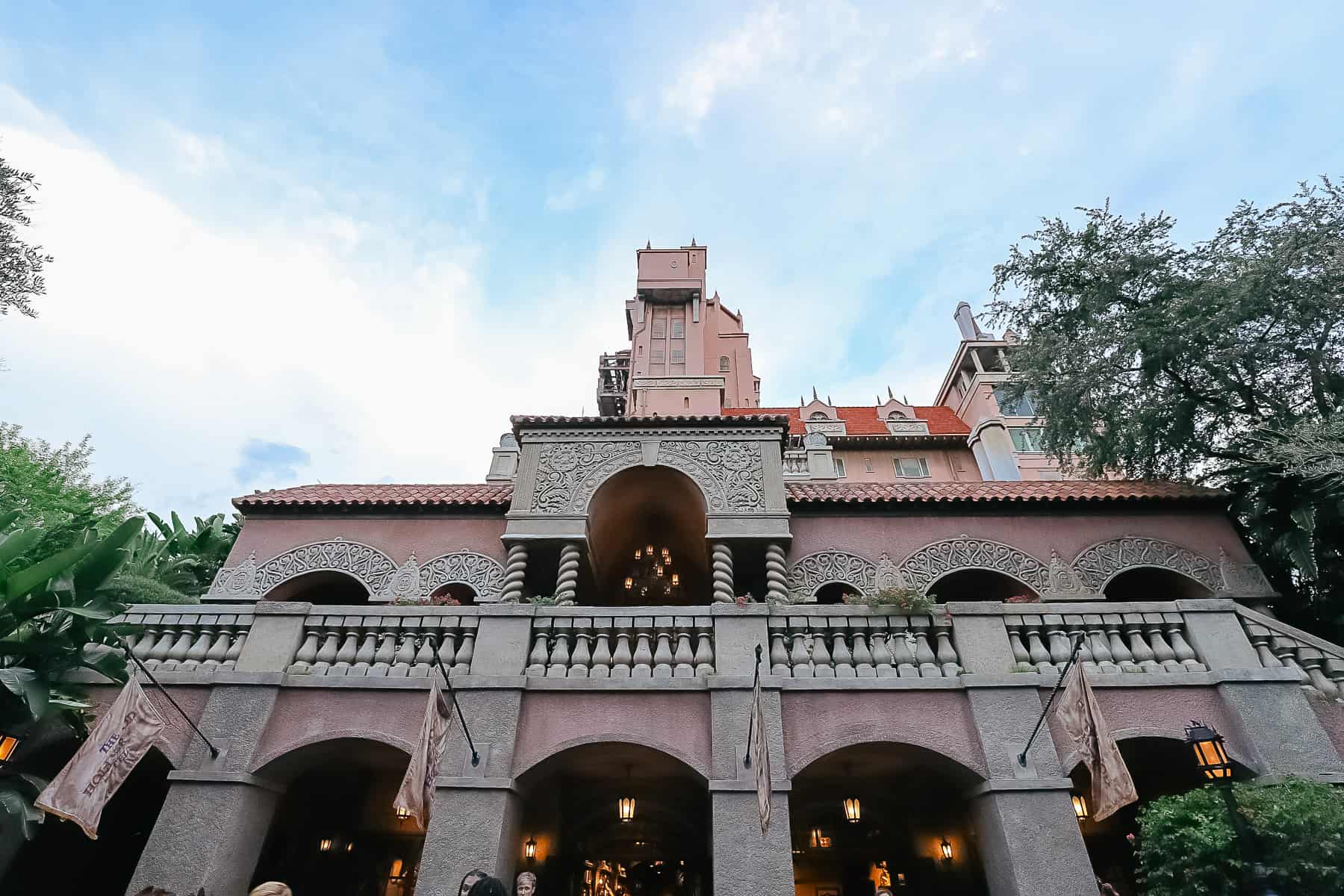 the side view of the Tower of Terror Hotel patio, ride exit, and gift shop entrance 