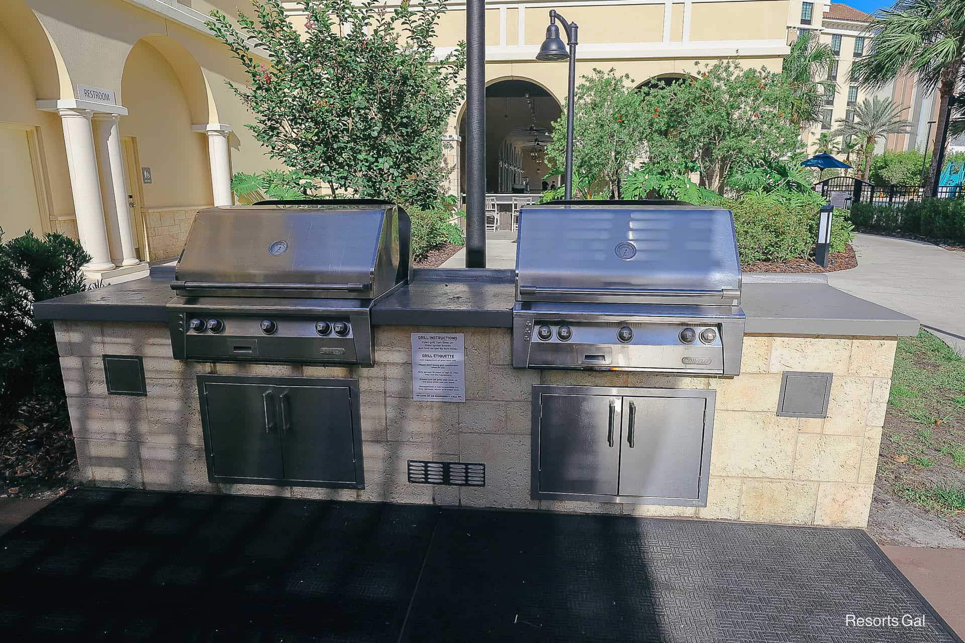 a pair of barbecue grills for guests to use