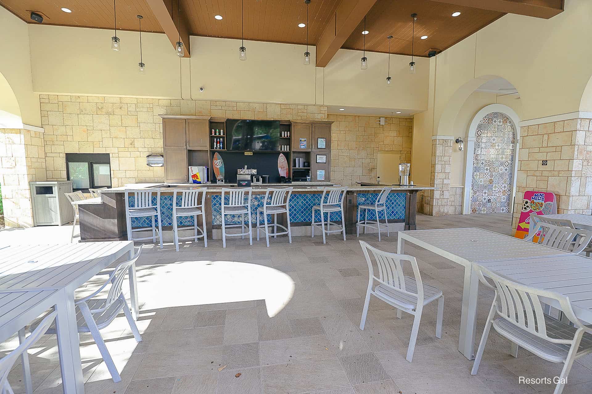 an outdoor bar and grill near the Hilton shared pool