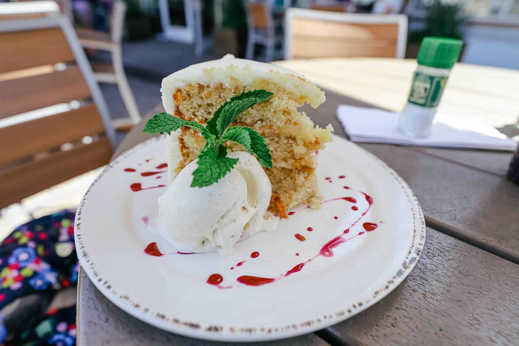 a slice of Hummingbird Cake with ice cream 