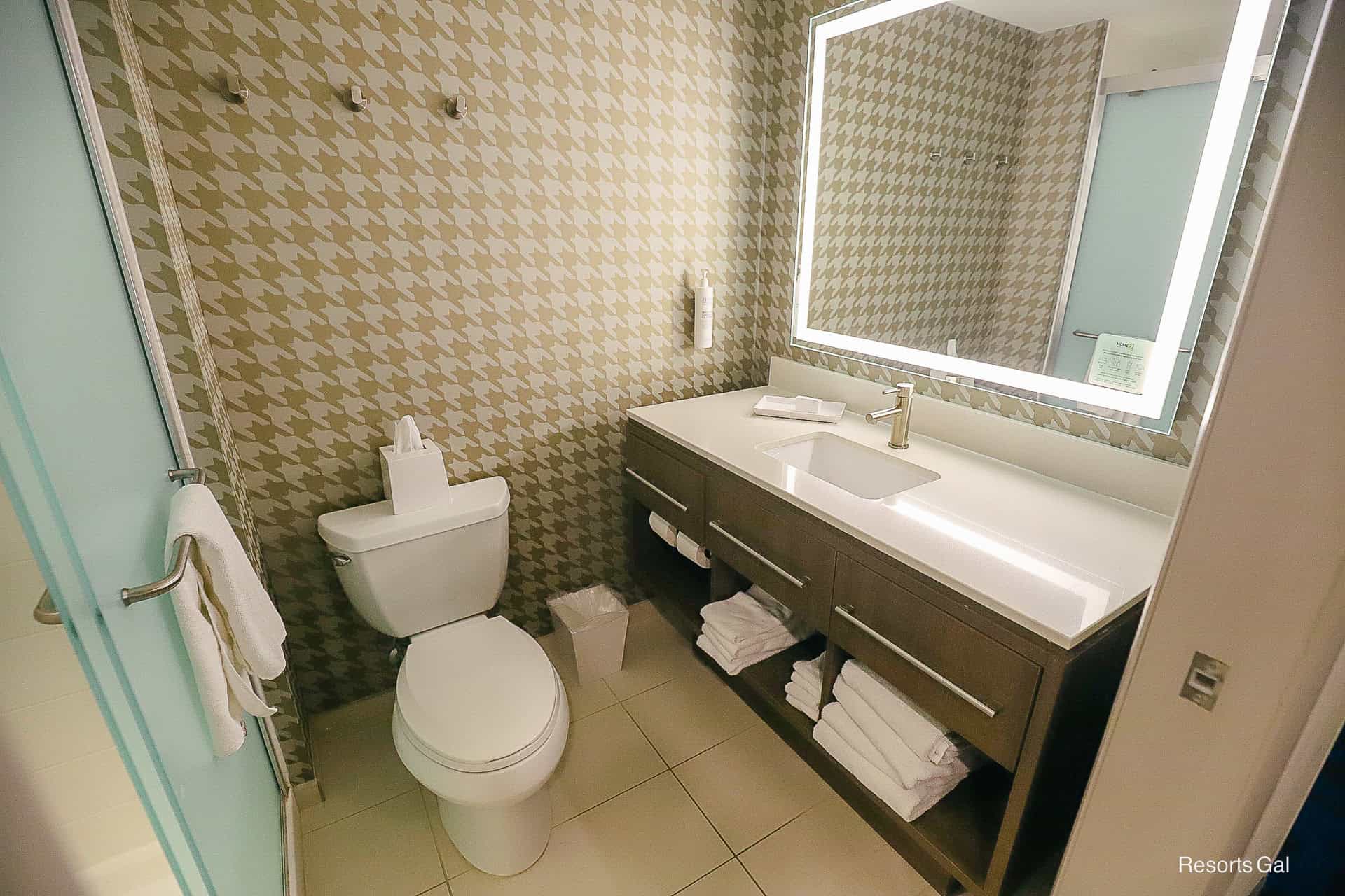 the full size bath features one sink with plenty of counterspace in the Flamingo Crossings Home2 Hilton Hotel near Disney World