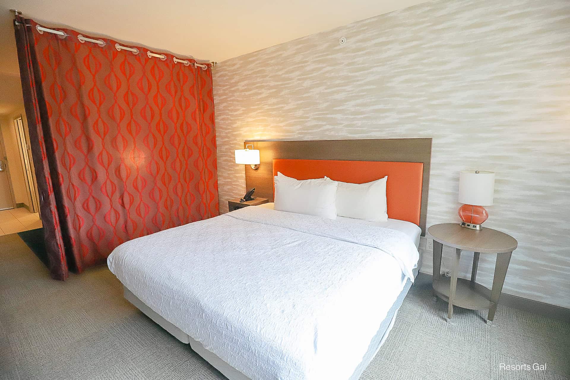 a king-size bed in the Hilton at Flamingo Crossings