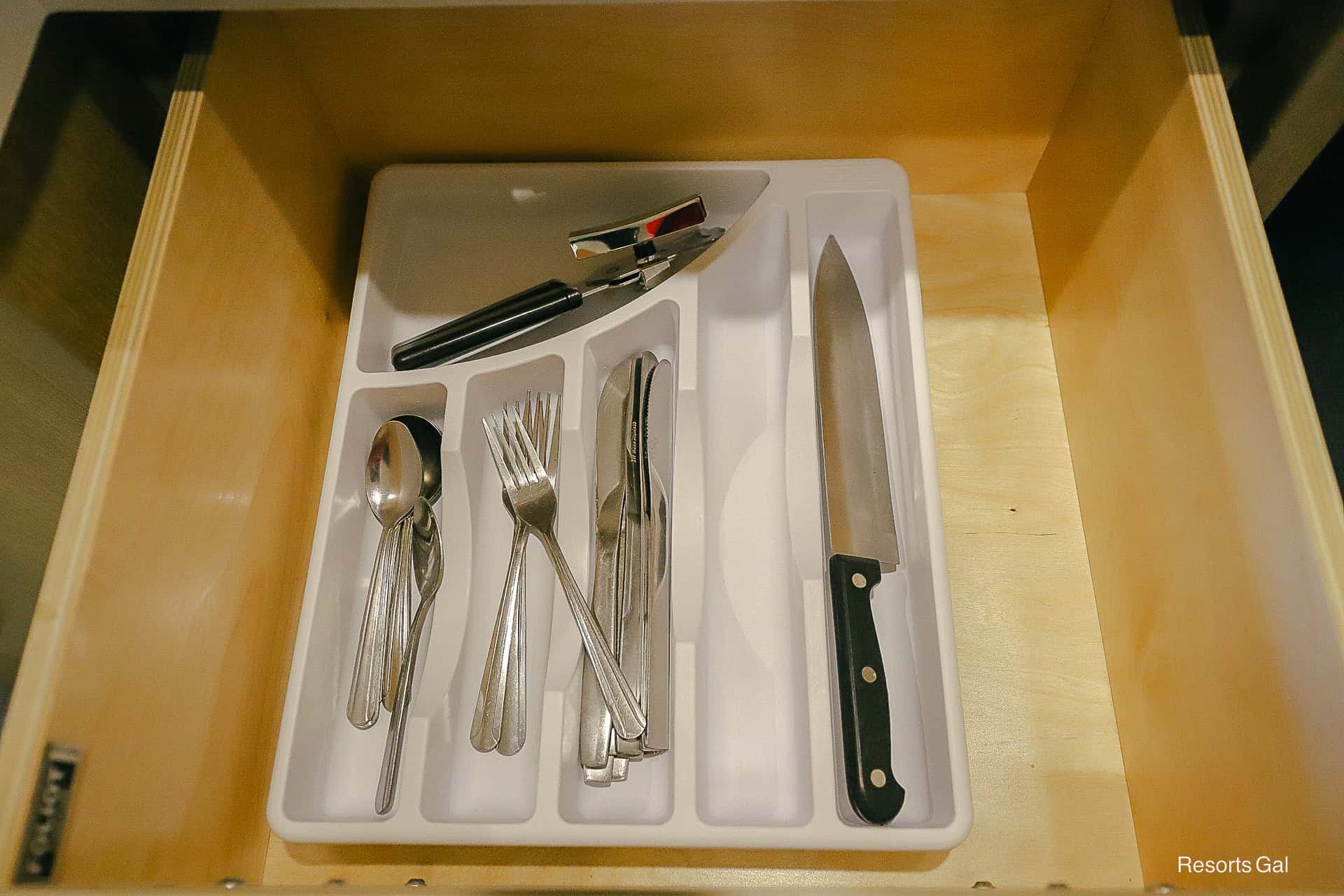 a drawer filled with silverware and utensils