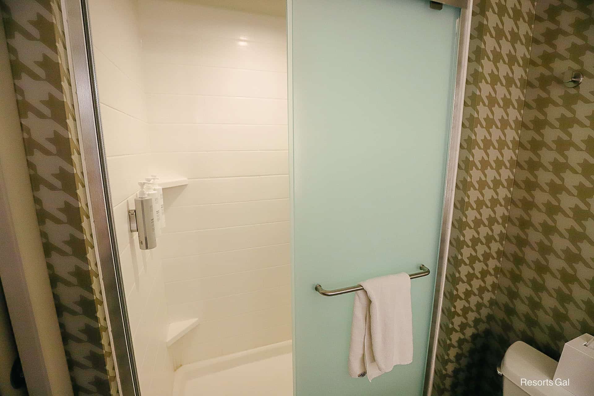 a walk in shower at the Home2 Hilton at Flamingo Crossings