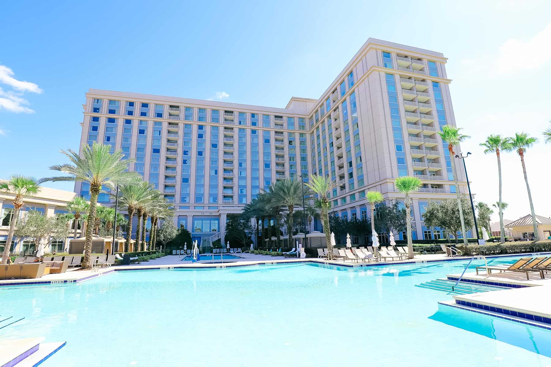 the pool with the off-site hotel in the distance, Waldorf Astoria Orlando 