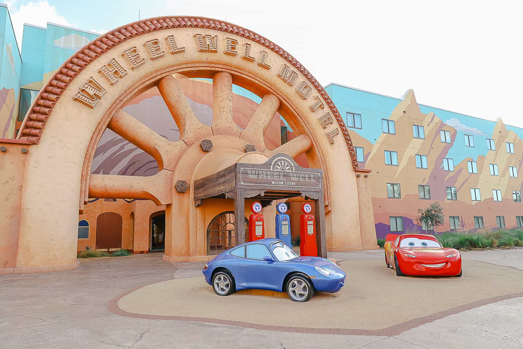 Sally and Lightning McQueen sit outside the Art of Animation hotel creating an immersive theme