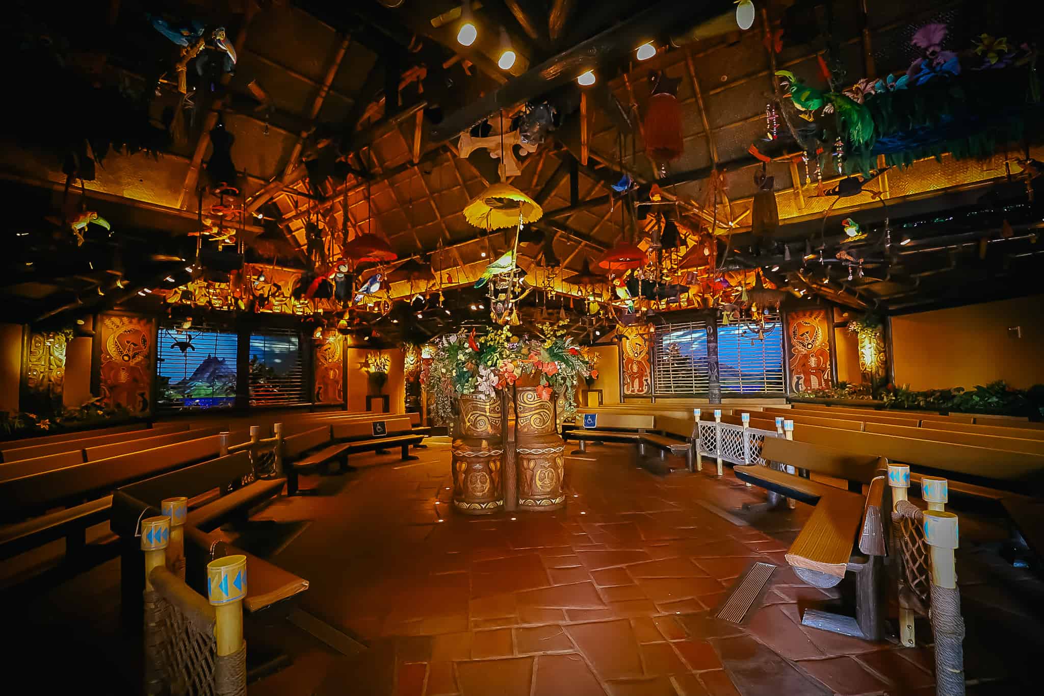 interior of the Enchanted Tiki room with benches for guests to watch the show 