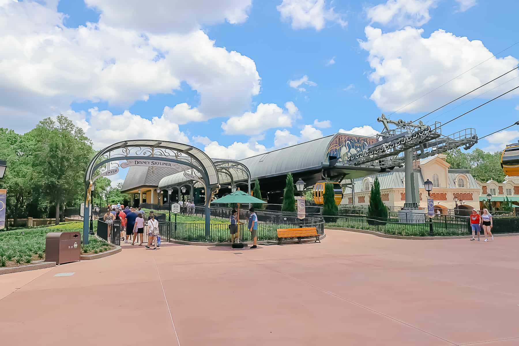 guests waiting in line for the Skyliner at Epcot's International Gateway 