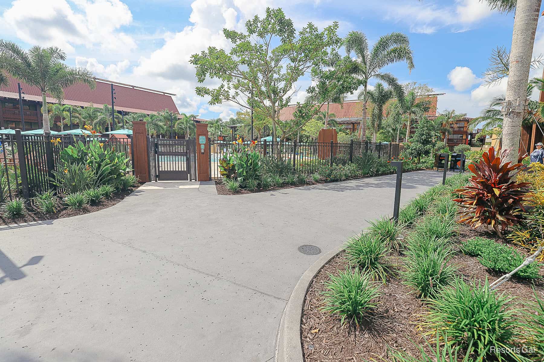 the pathway curves to the right ahead of the pool