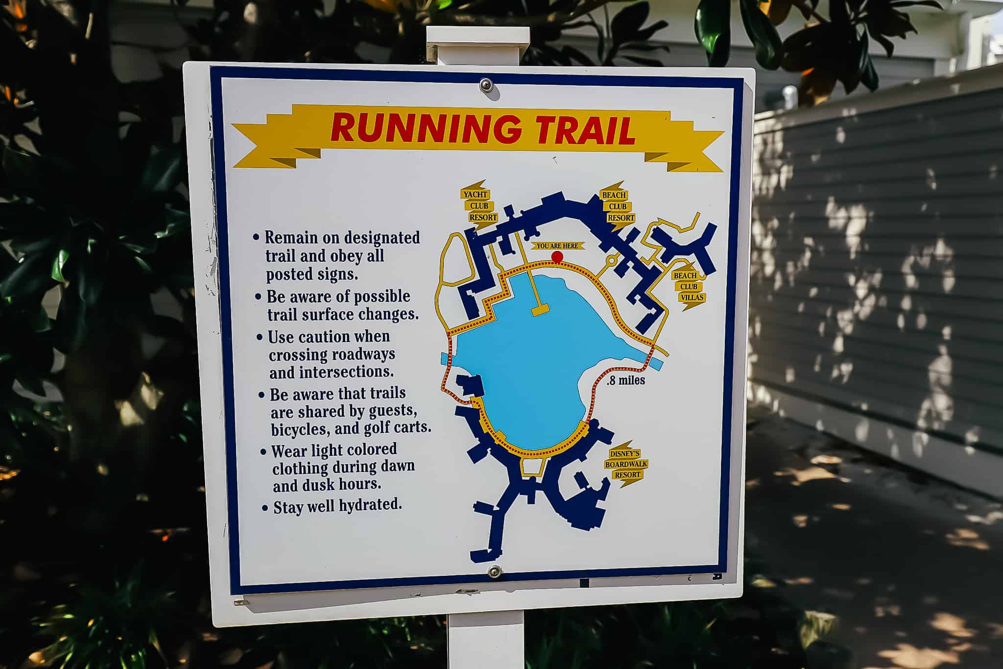 a sign with an image of the running trail at Beach Club, Yacht Club, and Boardwalk 