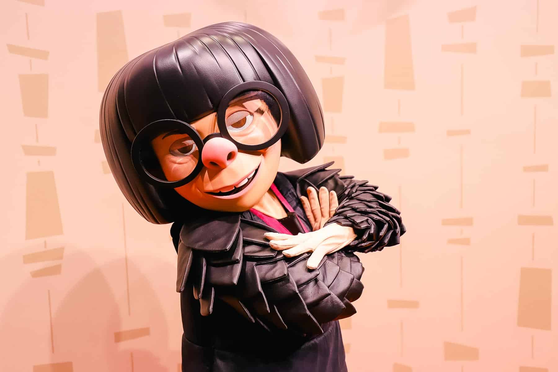 Edna Mode posing with her arms crossed. 