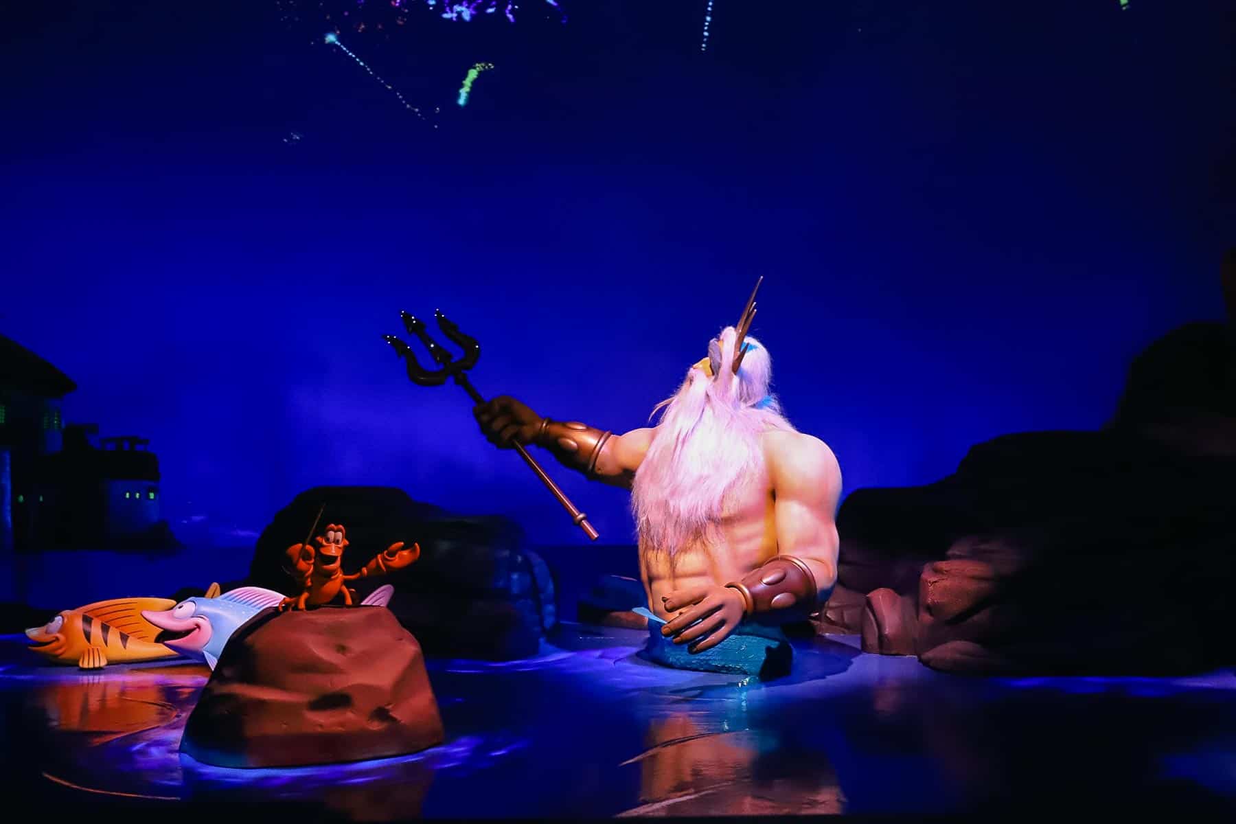 King Triton makes fireworks explode in this scene while Sebastian conducts an orchestra. 