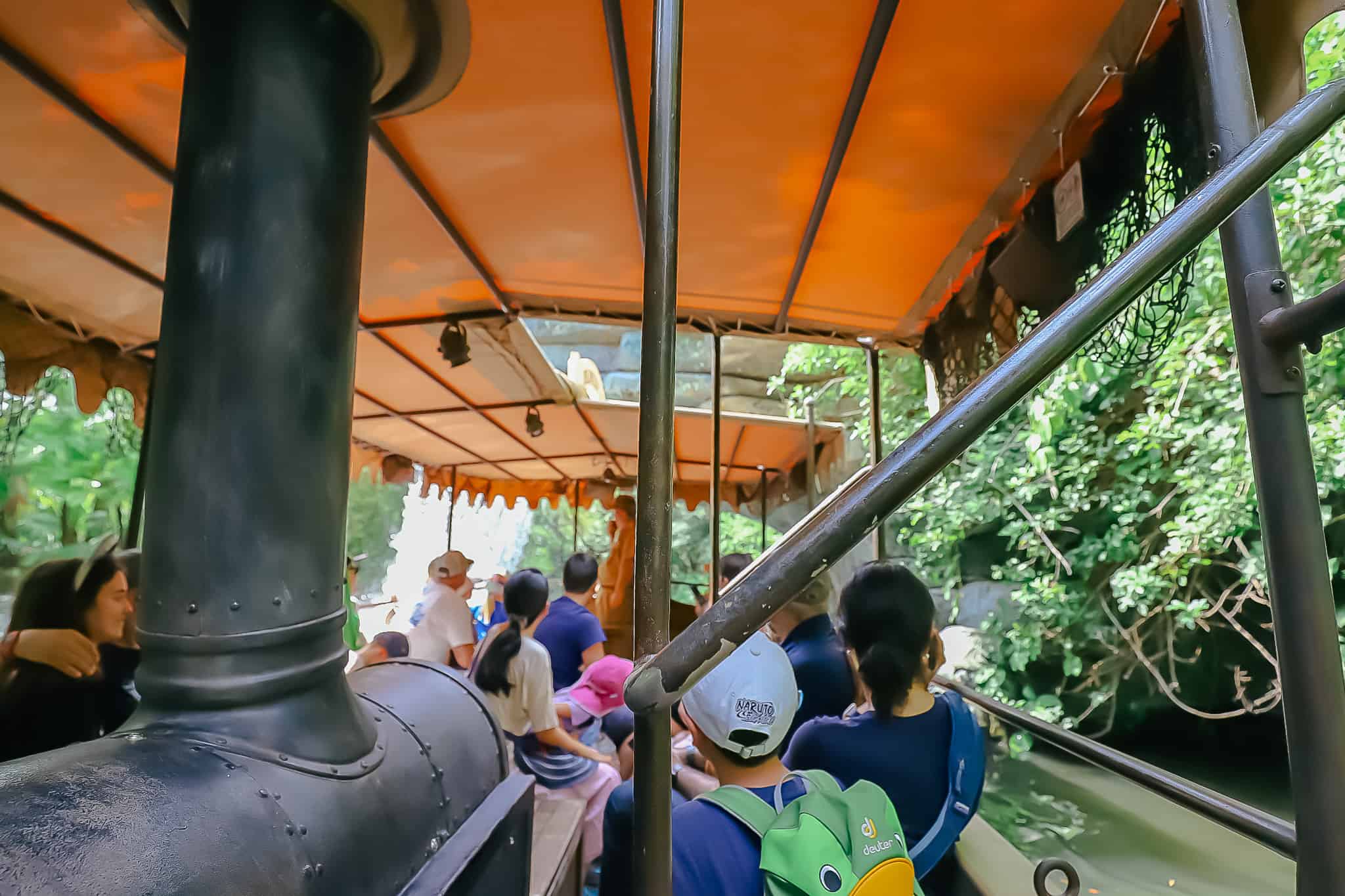 Guests sailing into a cavern up ahead on Magic Kingdom's Jungle Cruise. 